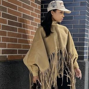 SUPER TRENDY w/comfortable fit tan fringe top with button sleeves!